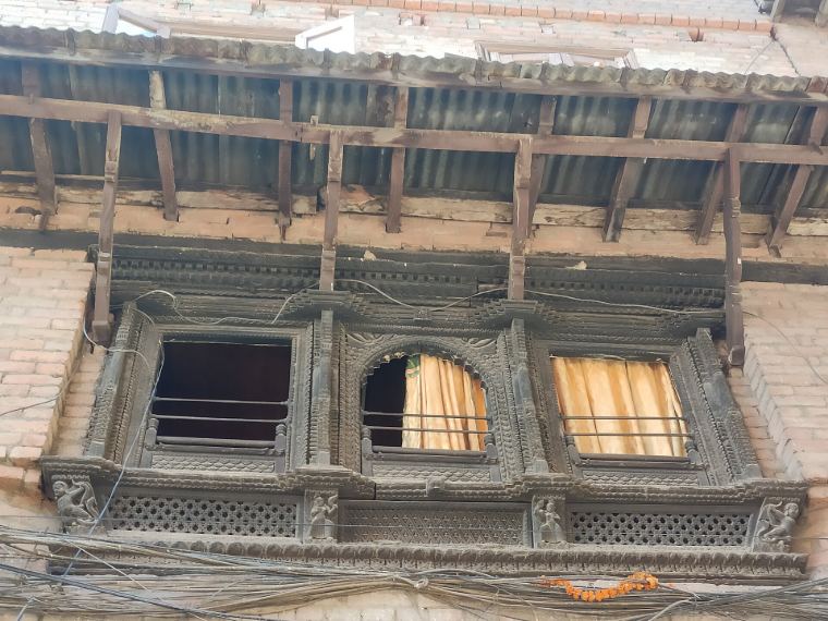 Carved wooden windows on an old Newar house in Bhaktapur